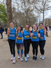 Marathon runners with The Childhood Trust t-shirts