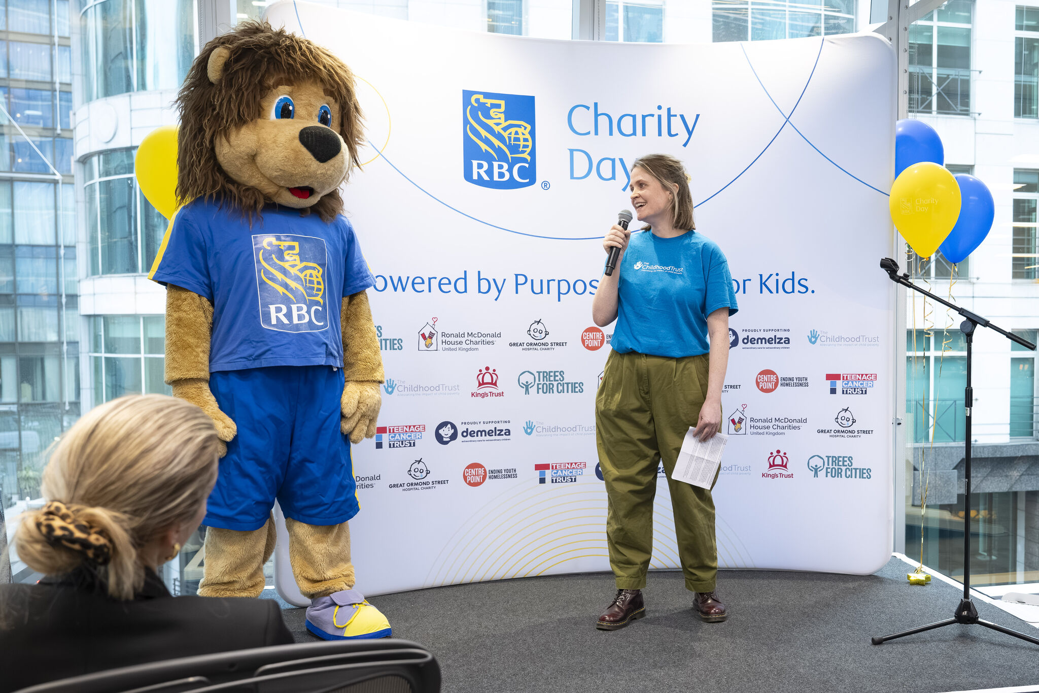 The RBC mascot with The Childhood Trust's staff