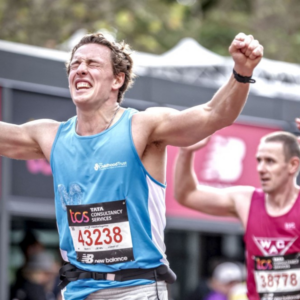 Marathon runner wearing a The Childhood Trust shirt