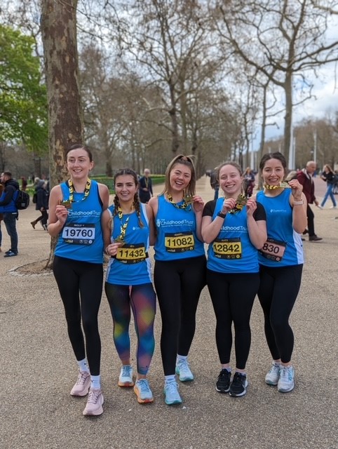 Marathon runners wearing The Childhood Trust shirts