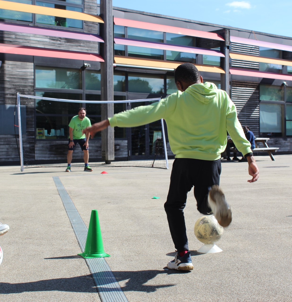 Child kicking a football